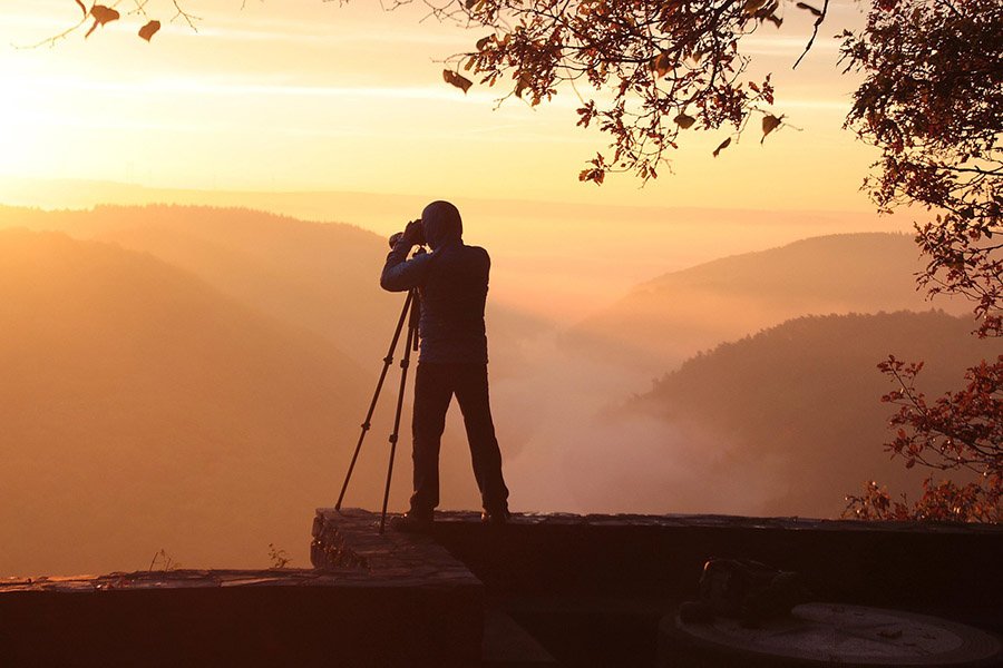 Outdoor photographer with tripod